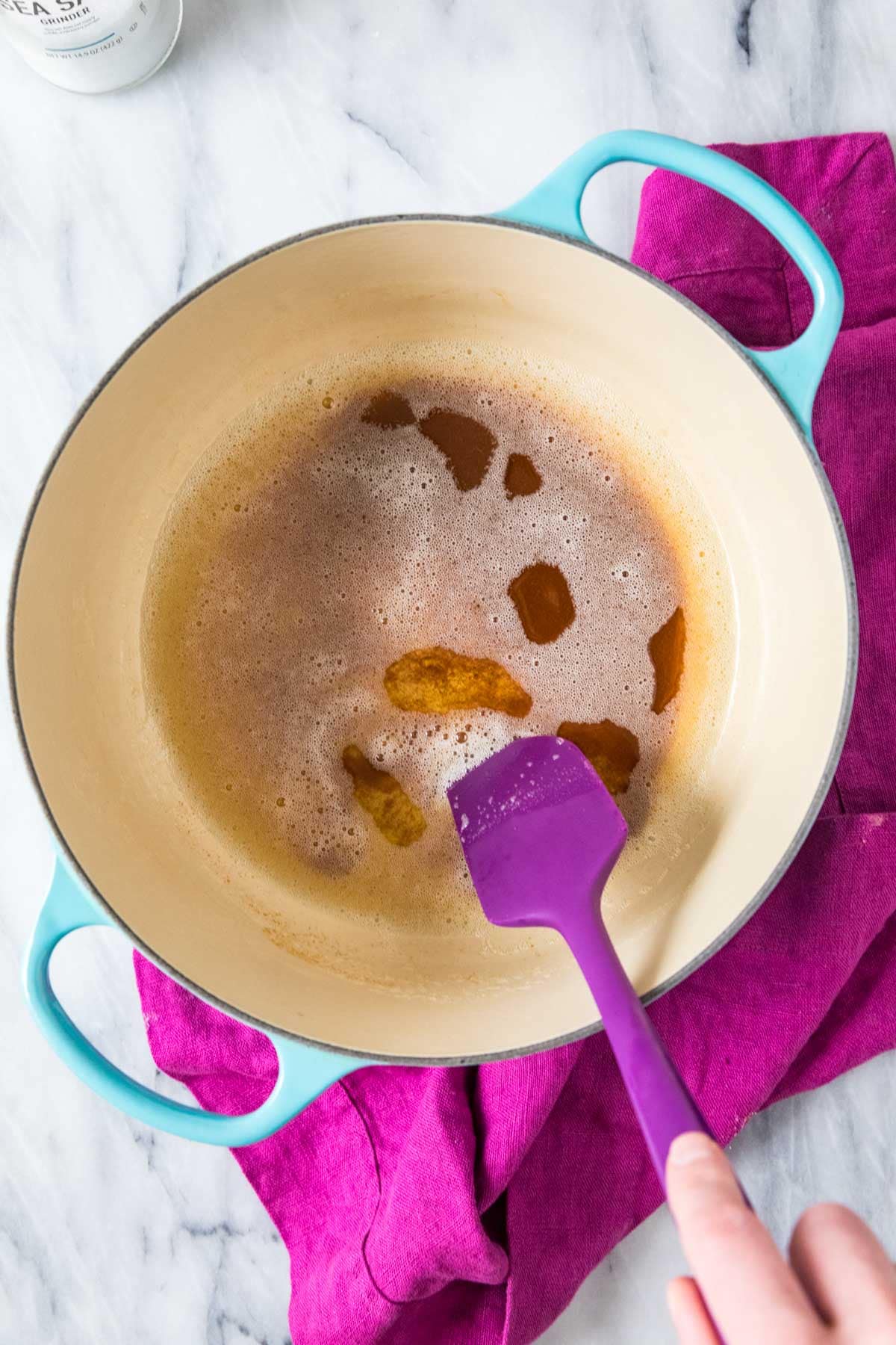 Overhead view of brown butter in a saucepan.