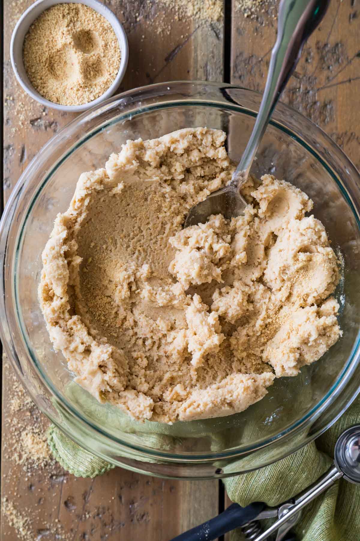 Overhead view of a bowl of cookie dough that's been infused with graham cracker crumbs.