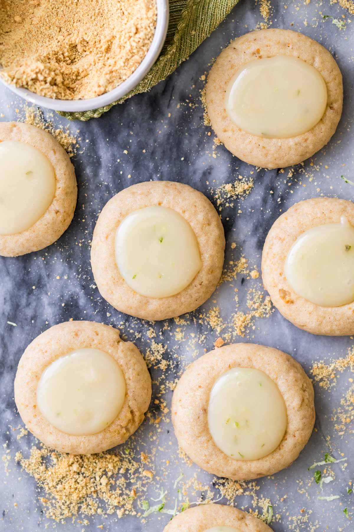 Overhead view of key lime cookies on a marble surface.