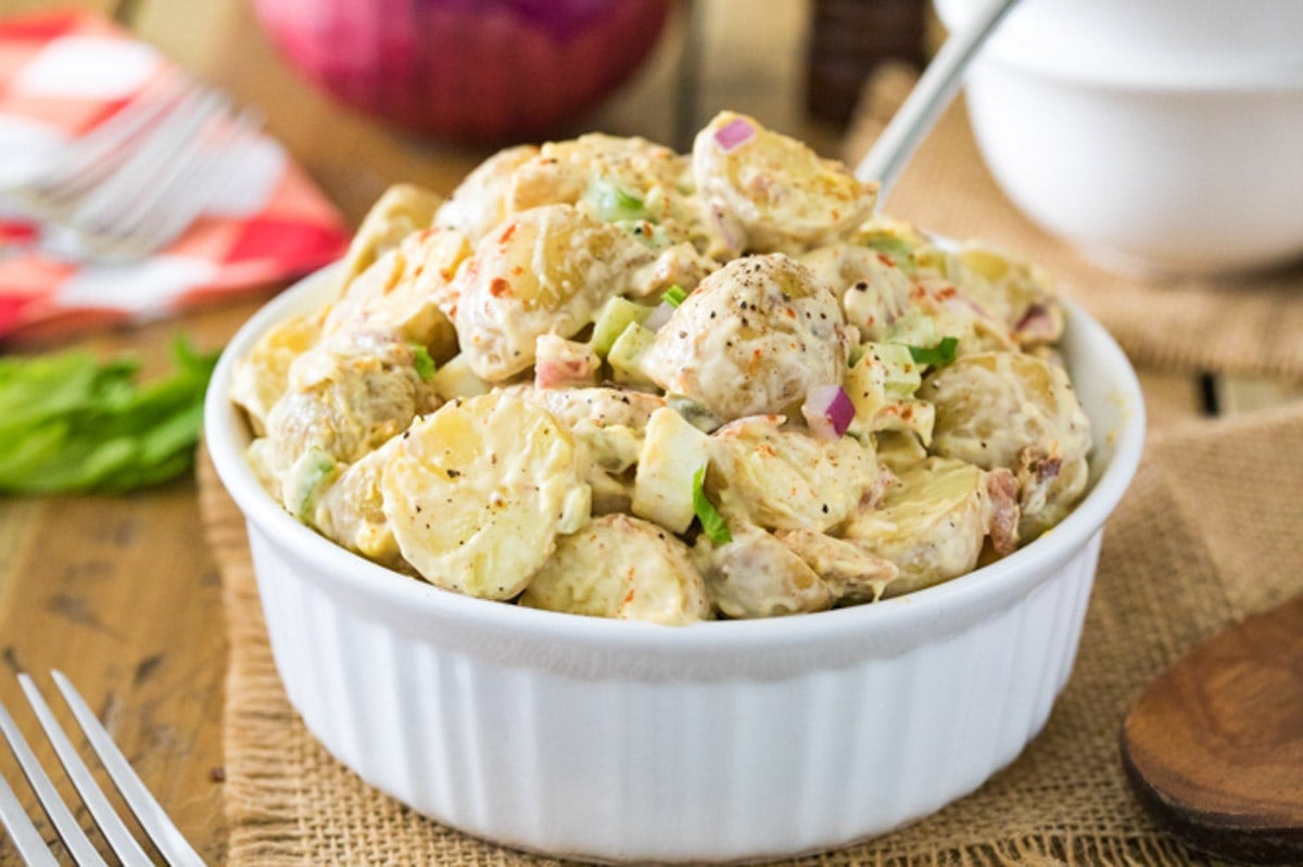 Large serving bowl of potato salad.
