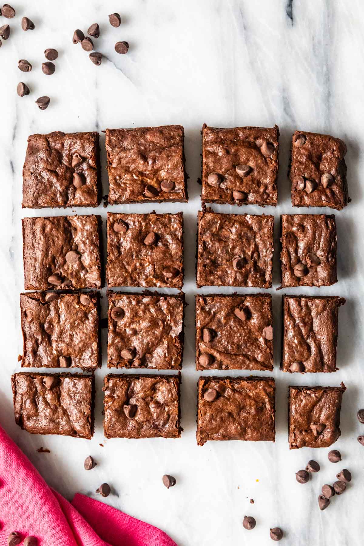 Overhead view of brownies made with bananas that have just been cut into squares.