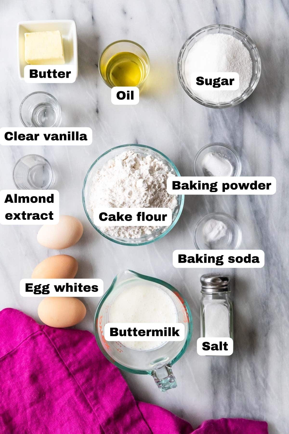 Overhead view of labelled ingredients including buttermilk, oil, clear vanilla, and more.