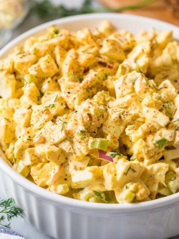 Egg salad in a white serving dish.