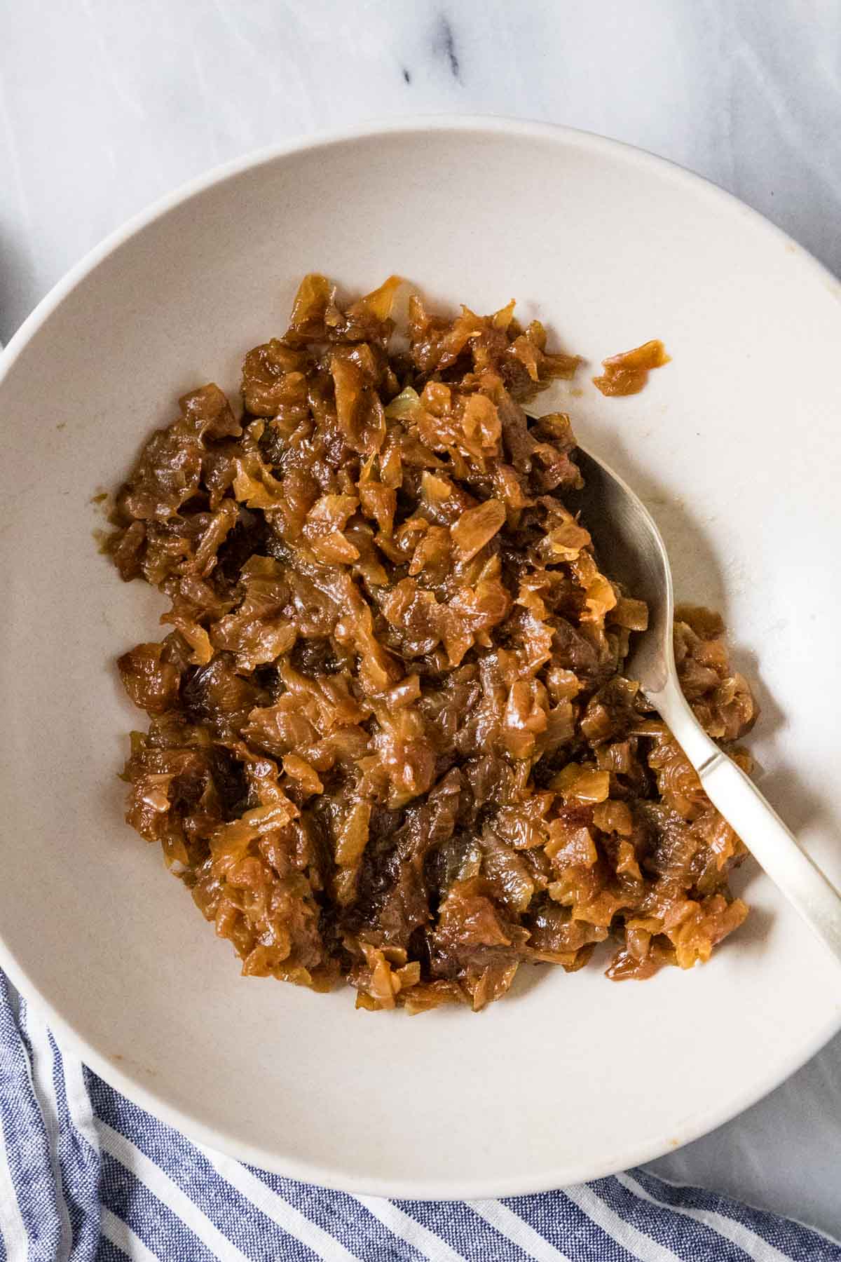 Overhead view of a bowl of diced caramelized onions.