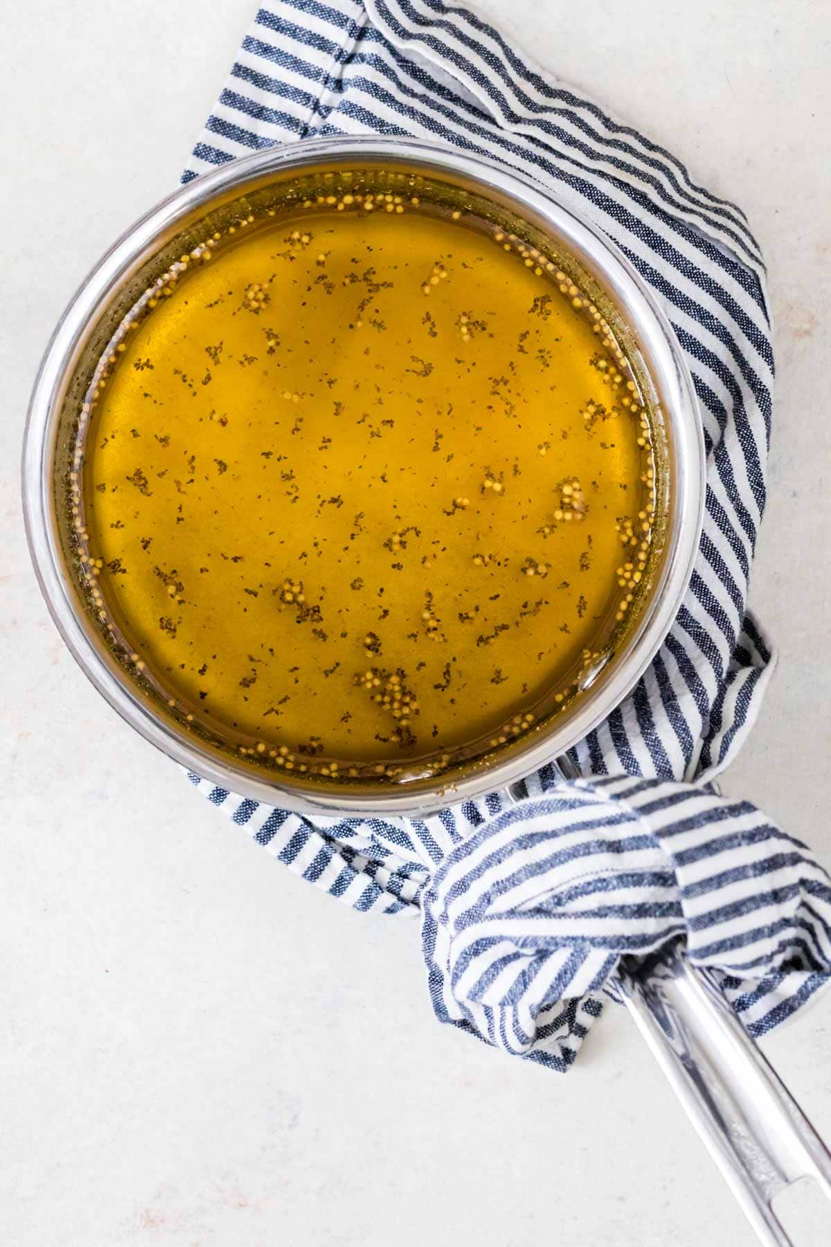 Overhead view of a saucepan with brine for making pickles.