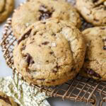 Close-up view of brown butter and bourbon cookies on a metal cooling rack.