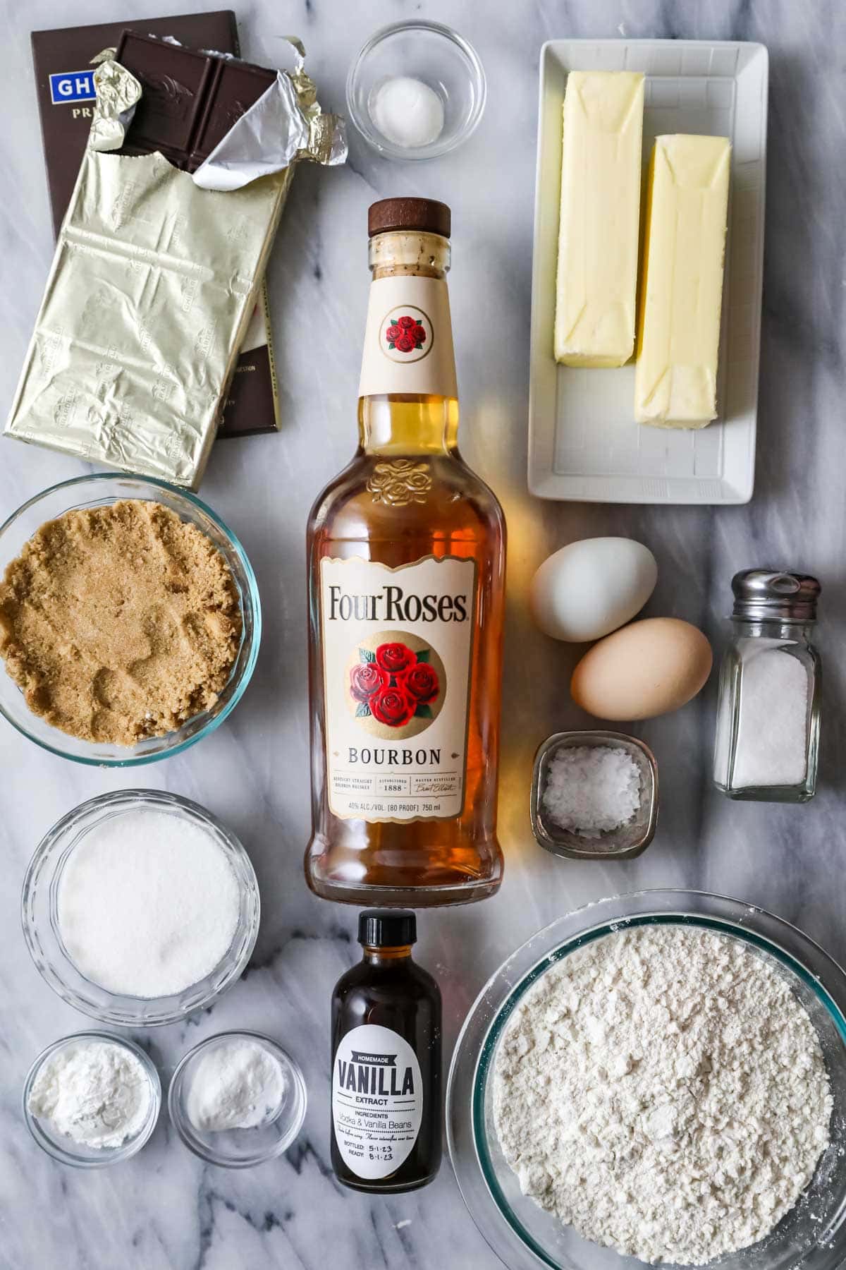 Overhead view of ingredients including bourbon, chocolate, butter, and more.