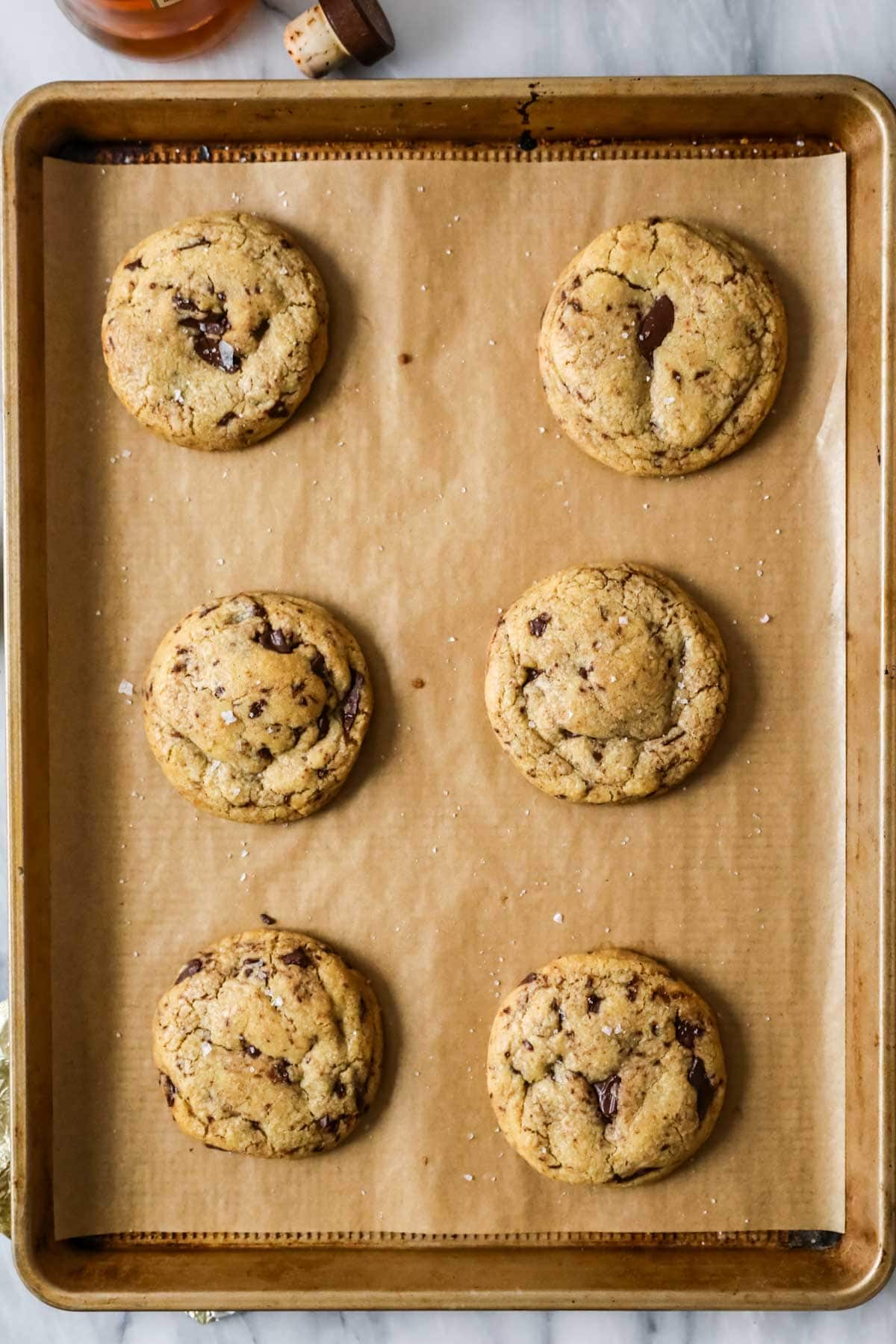 Overhead view of cookies made with bourbon and brown butter on a baking sheet.