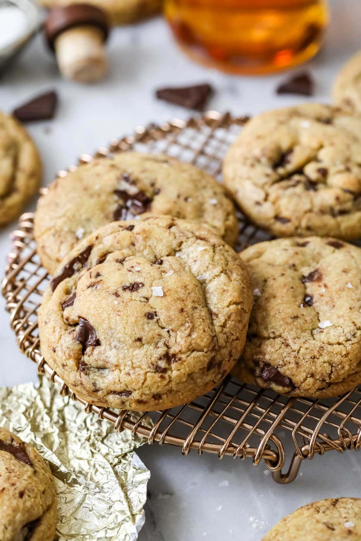 Close-up view of brown butter and bourbon cookies on a metal cooling rack.
