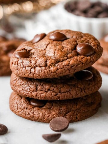 Stack of three double chocolate chip cookies.