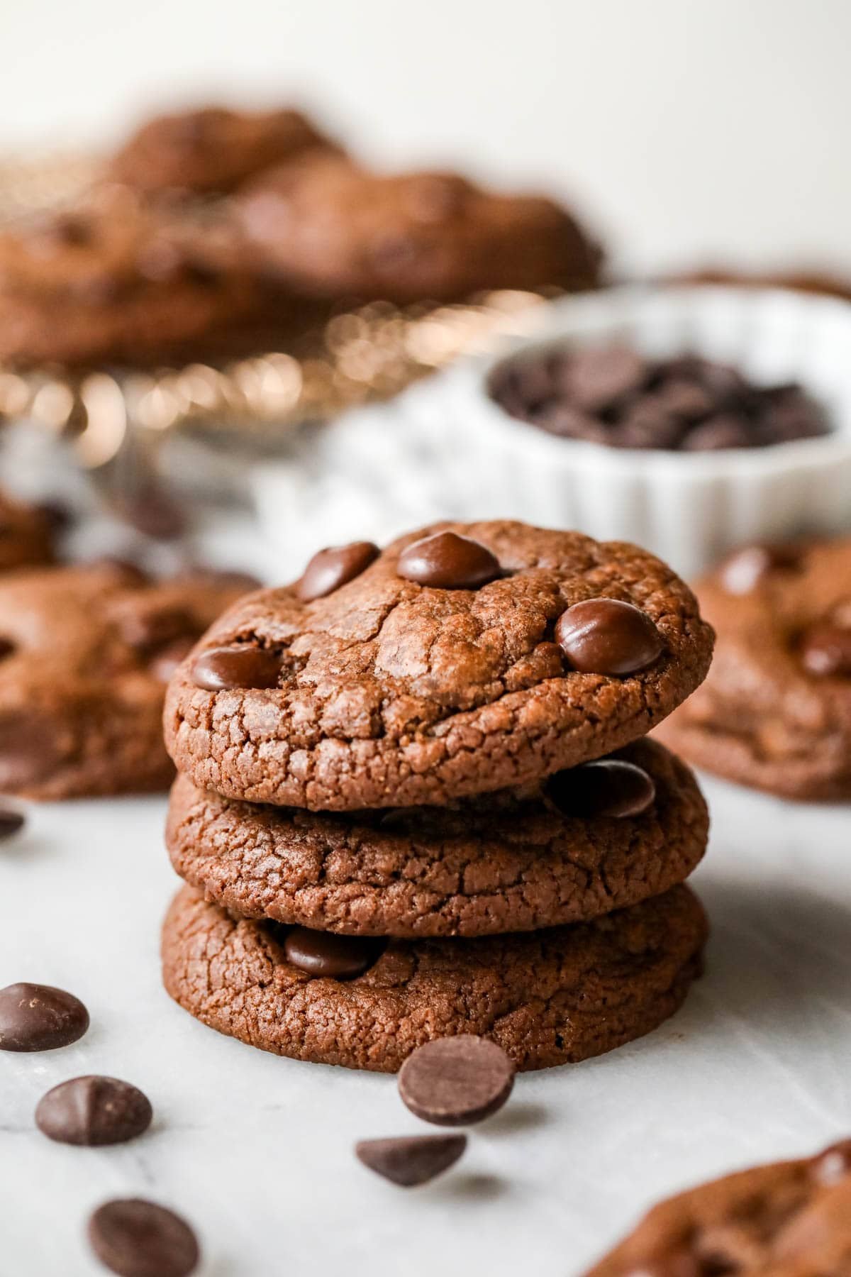 Stack of three double chocolate chip cookies.