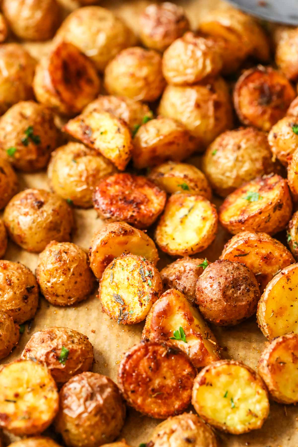 Close-up view of small potatoes after being roasted in the oven.