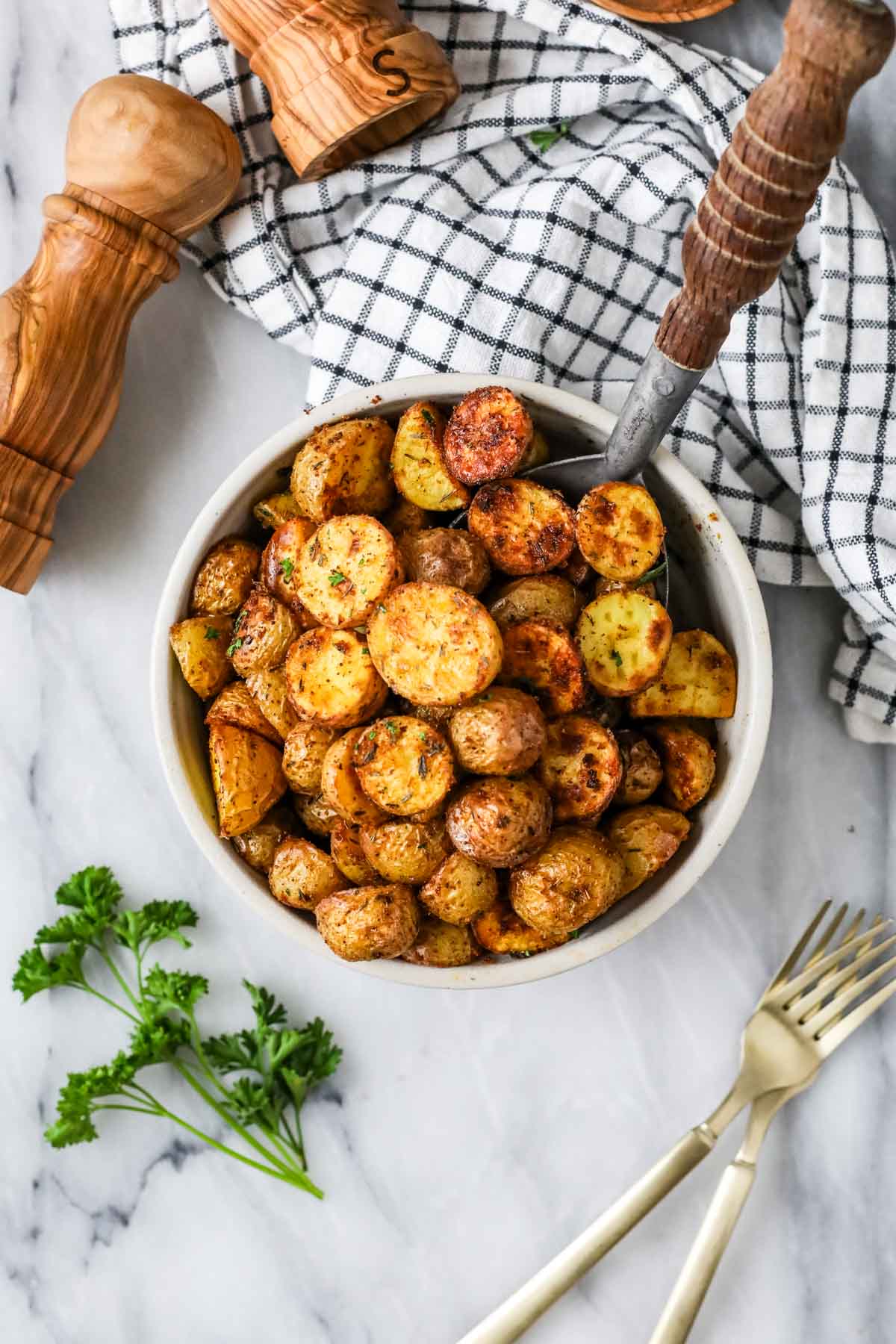 Overhead view of a bowl of small oven roasted potatoes.
