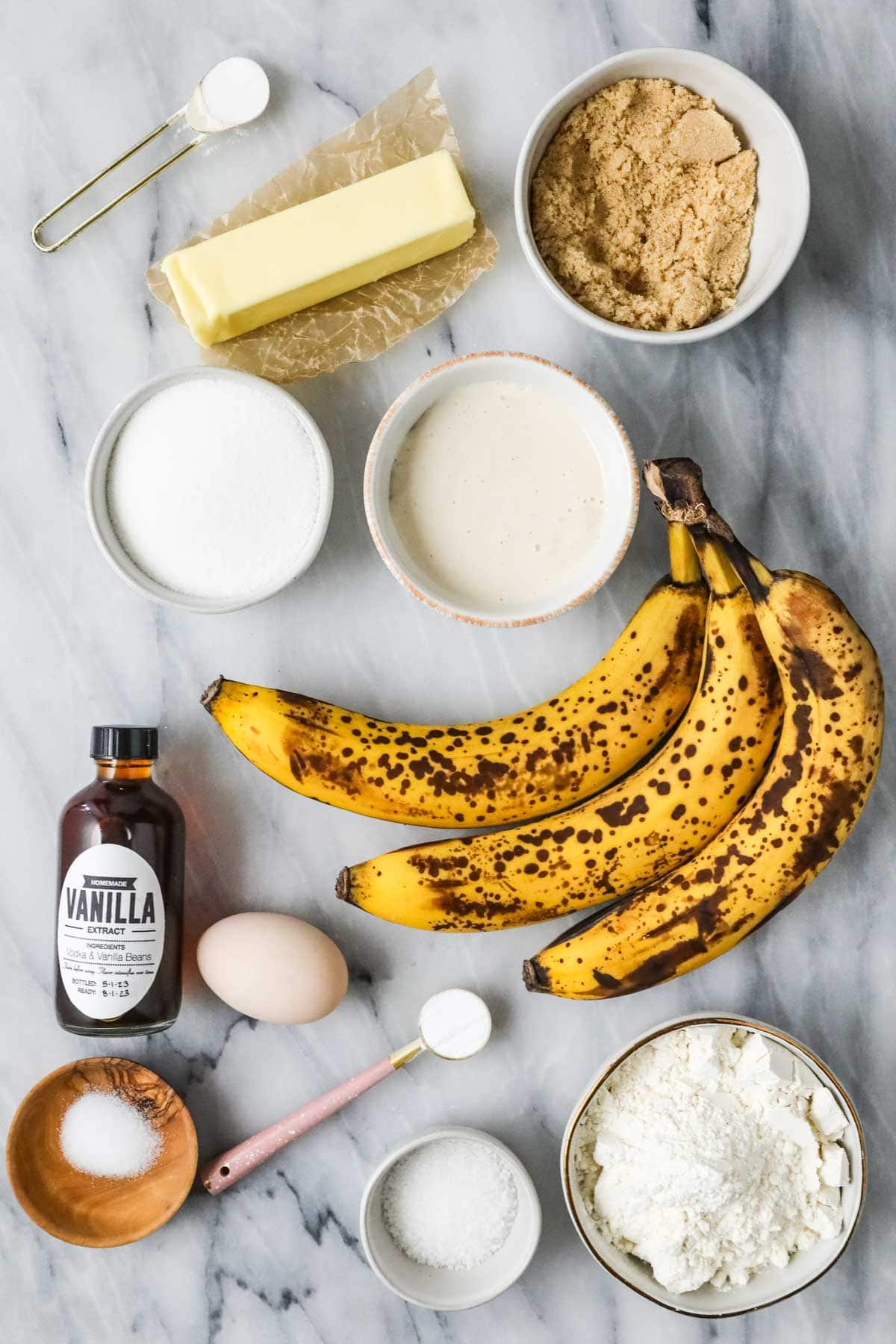 Overhead view of ingredients including bananas, brown sugar, sourdough discard, and more.