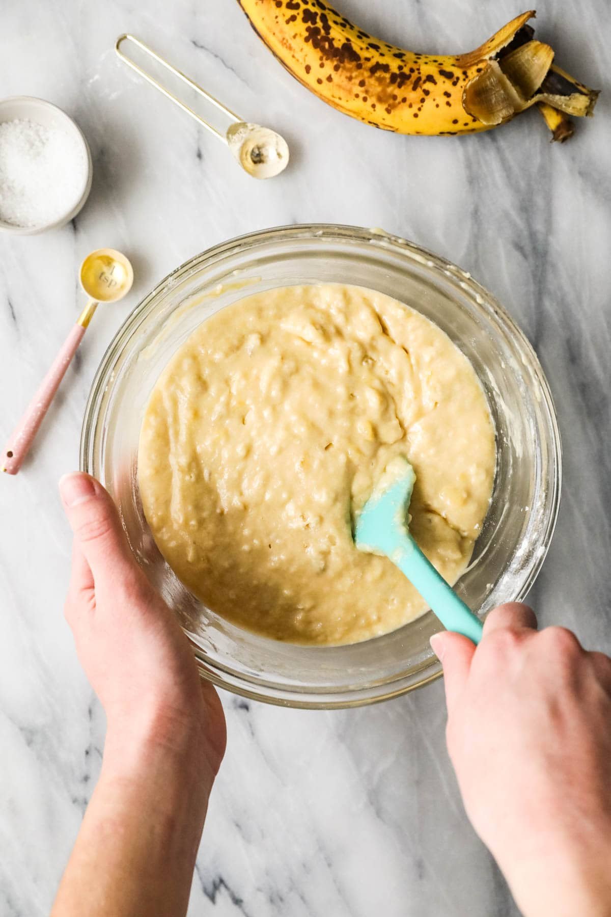 Overhead view of a bowl of banana muffin batter made with sourdough discard.