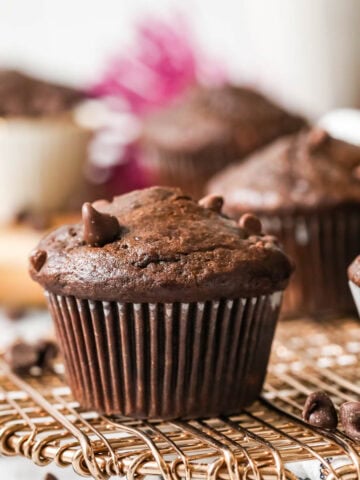 Chocolate banana muffins on a cooling rack.
