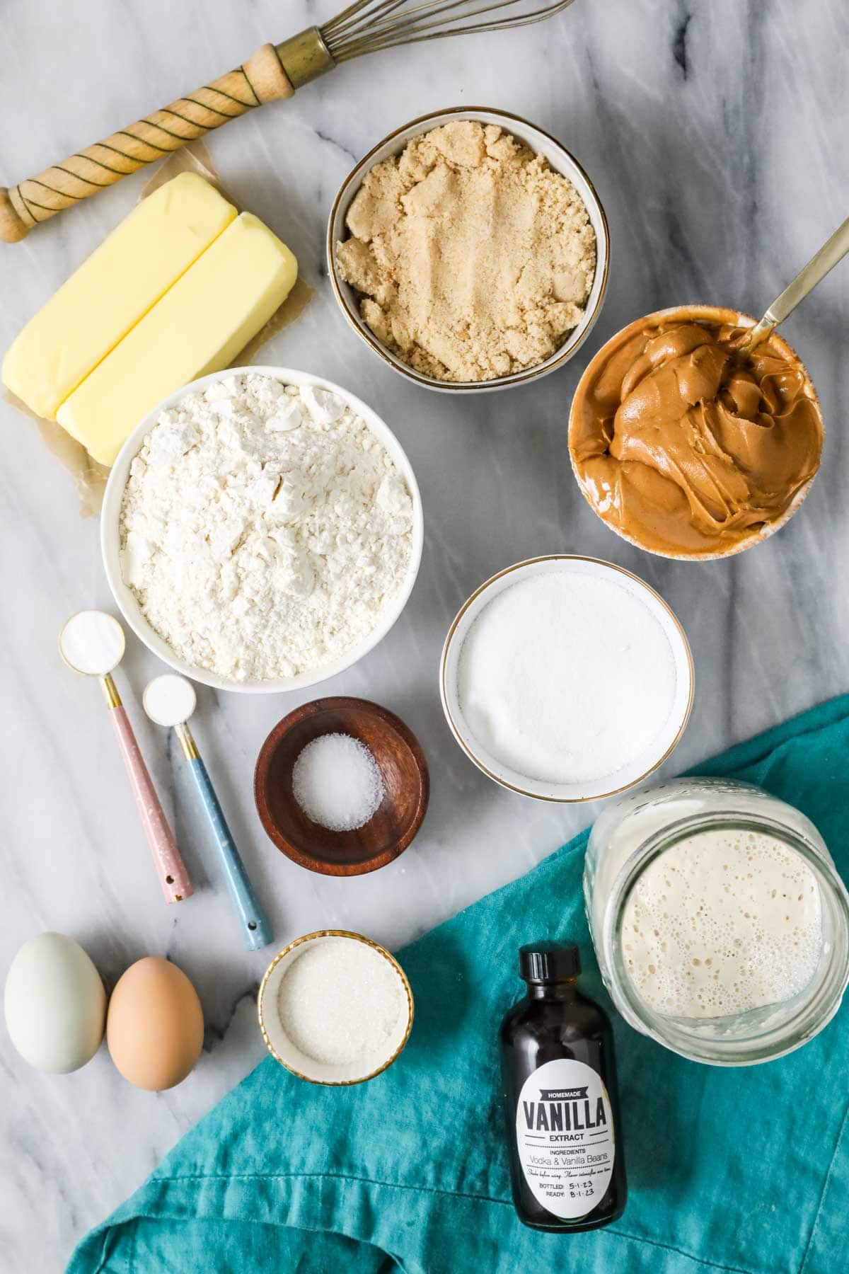 Overhead view of ingredients including peanut butter, sourdough discard, butter, and more.