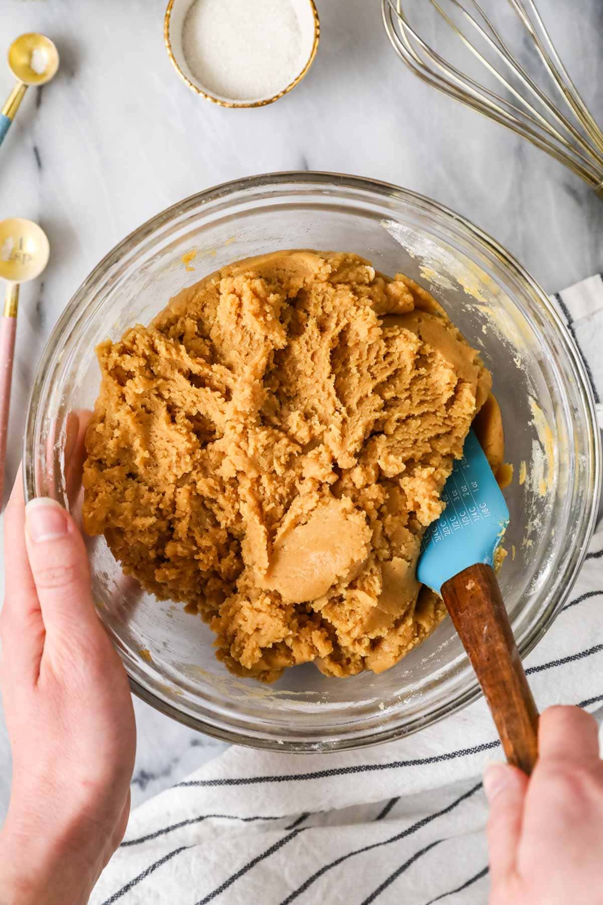 Overhead view of a bowl of cookie dough made with peanut butter and sourdough discard.