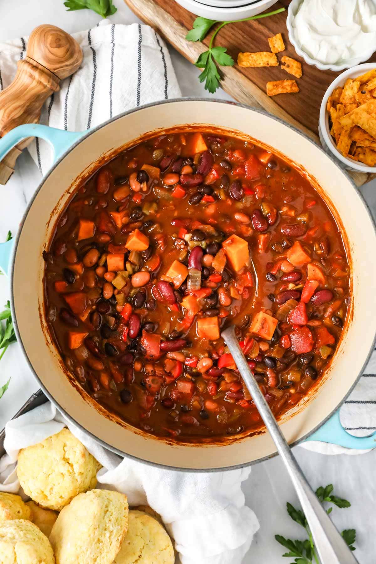 Overhead view of a pot of meatless chili made with sweet potatoes, beans, and more.