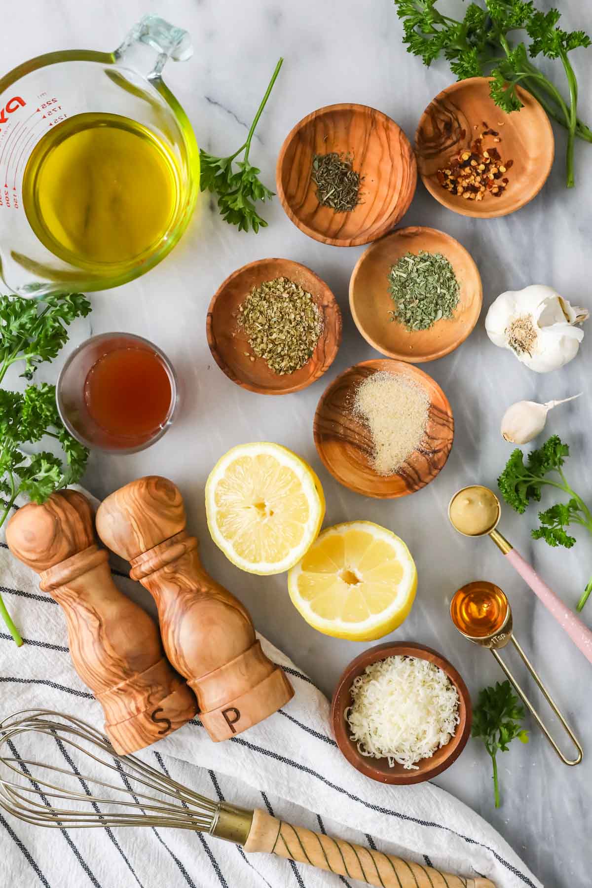 Overhead view of ingredients including spices, oil, vinegar, and more.