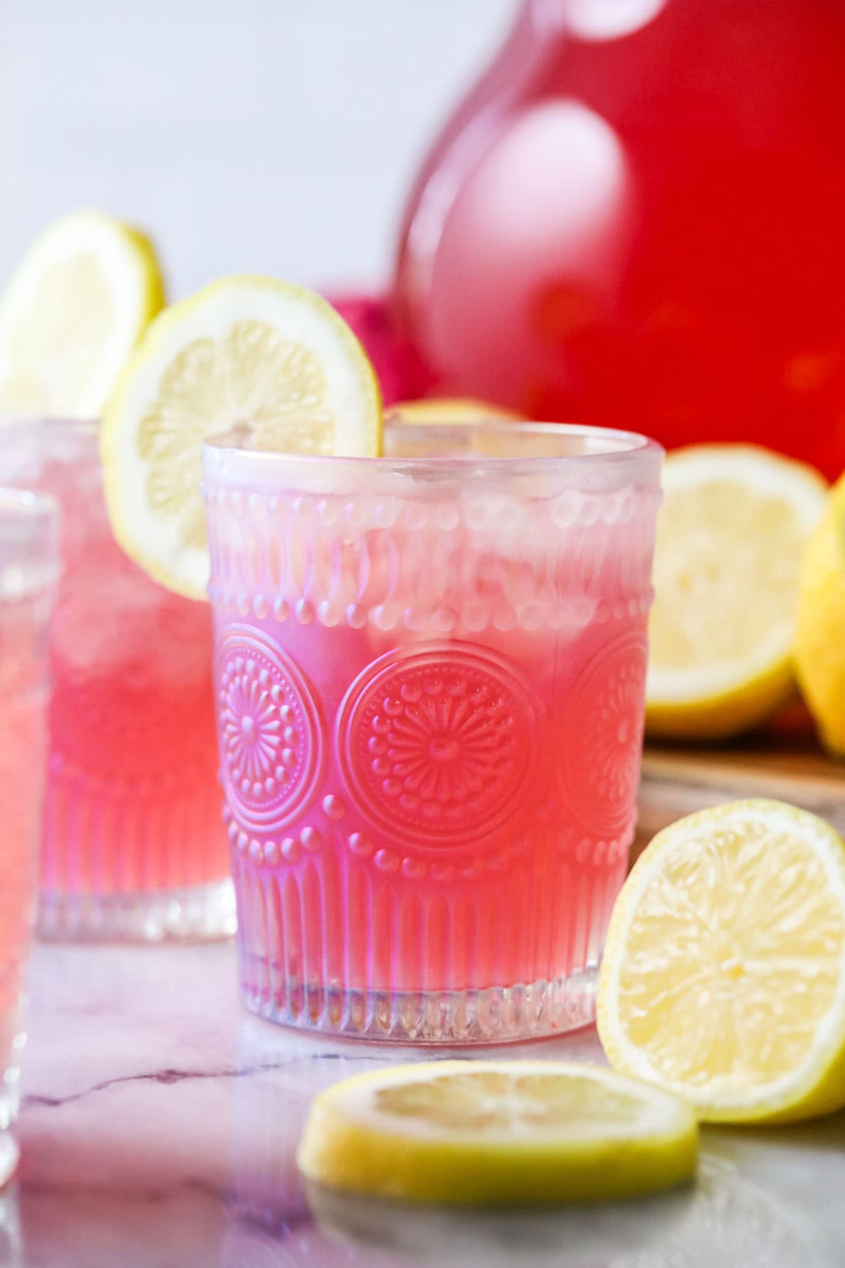 Glass of lemonade made with a splash of cranberry juice for a natural pink color.