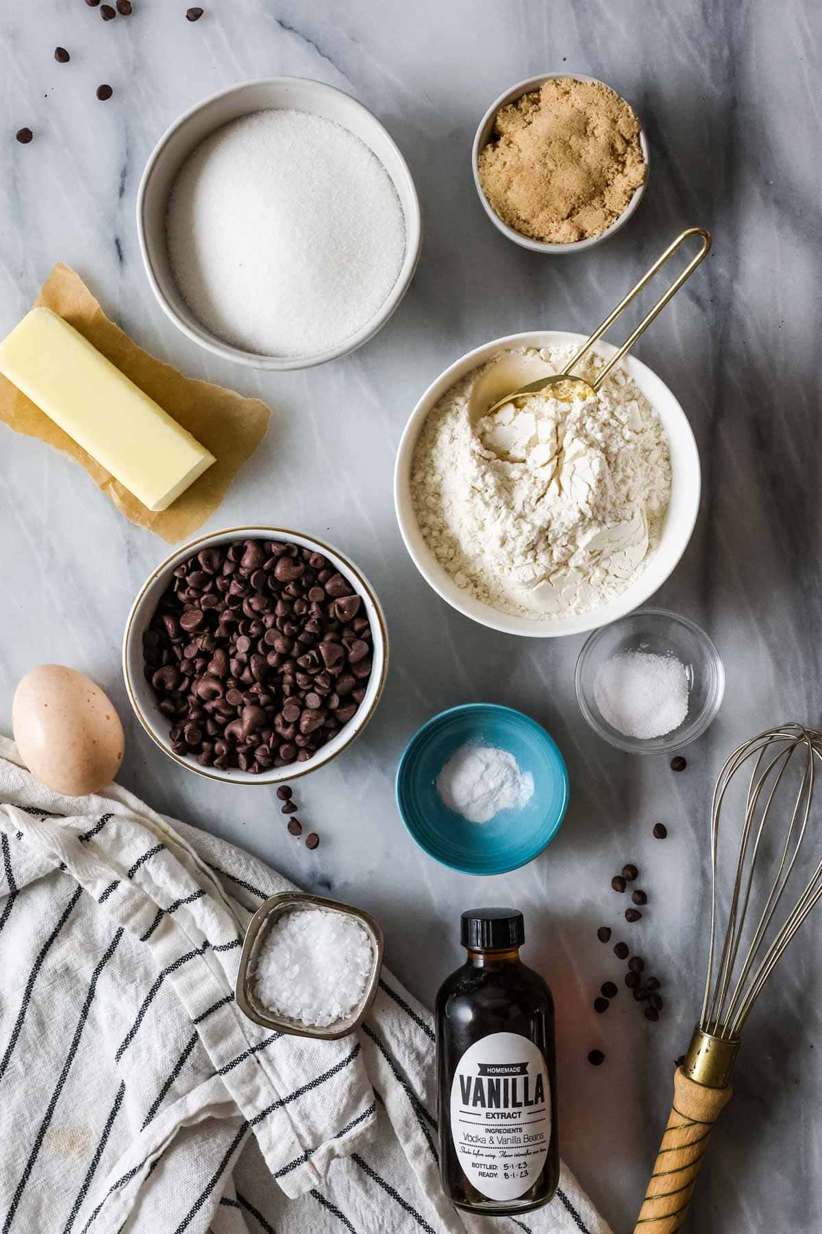 Overhead view of ingredients including flour, baking soda, butter, and more.