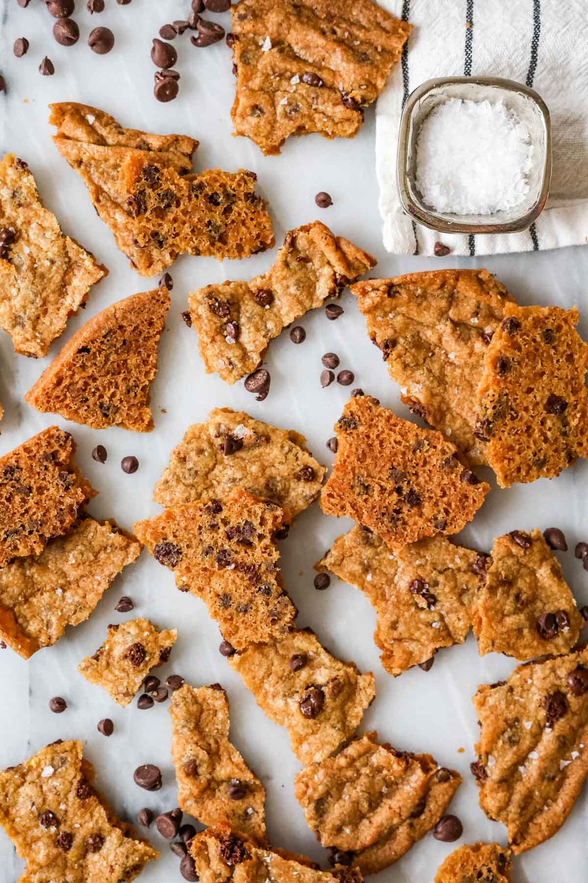 Overhead view of thin golden brown pieces of cookie brittle.