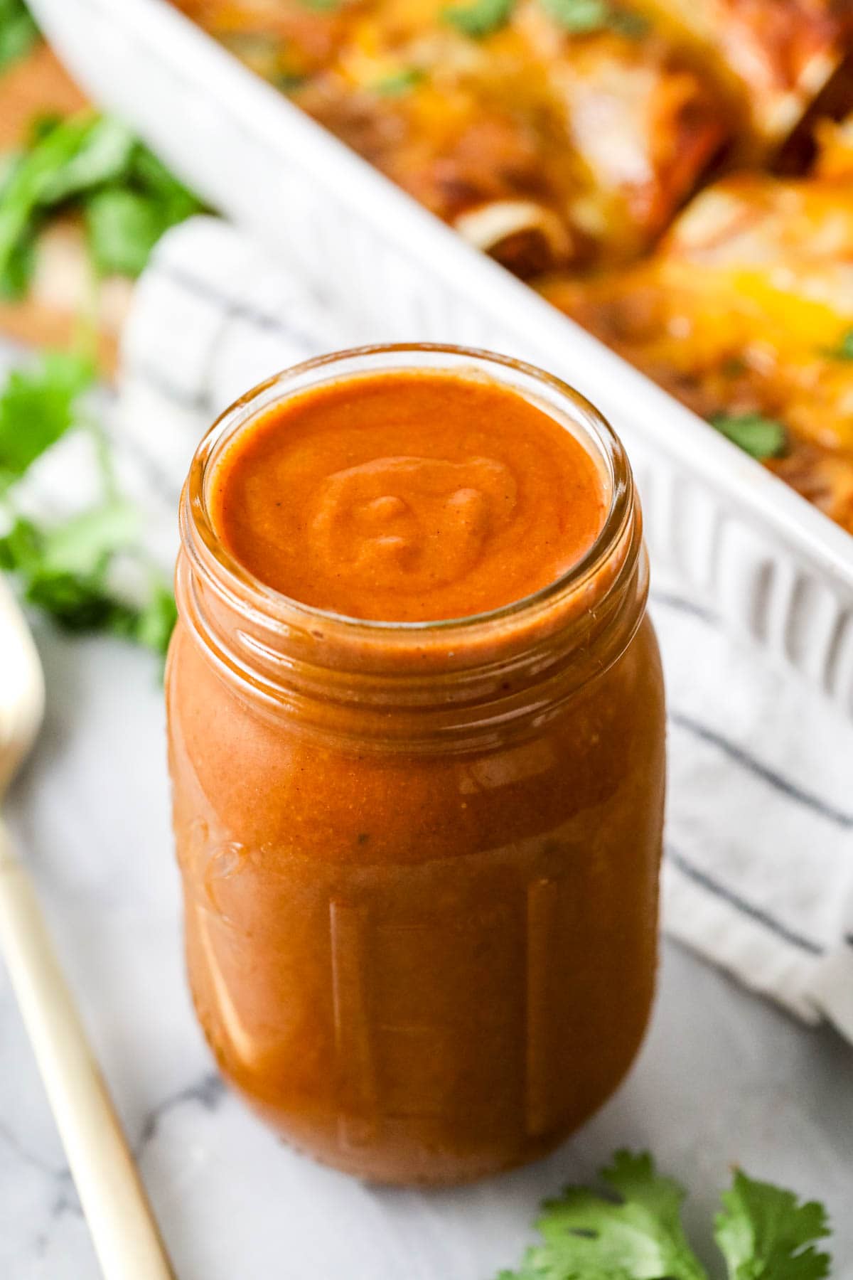 Jar of homemade sauce for enchiladas.