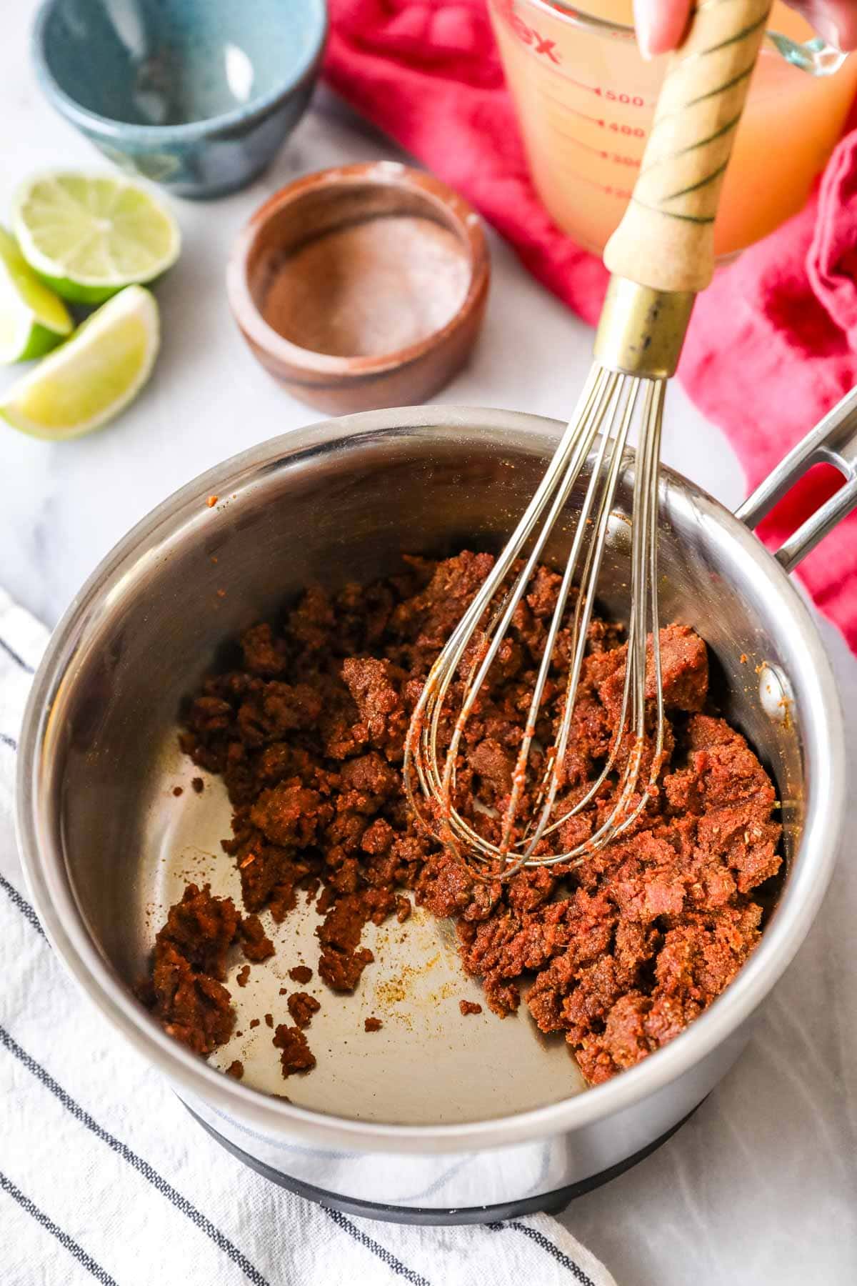 Stirring tomato paste into the roux for enchilada sauce -- dry and crumbly.