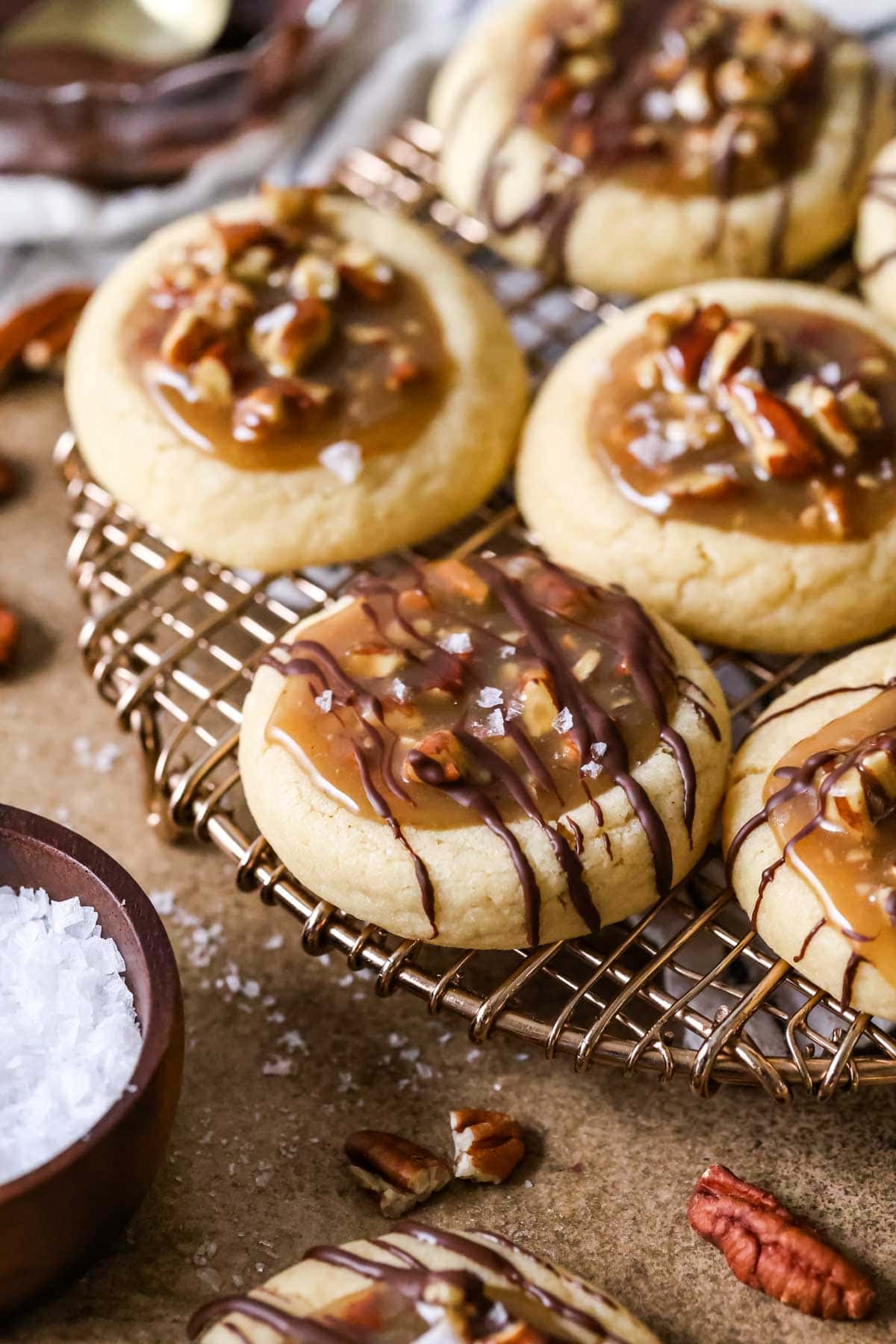 Cookies filled with a pecan pie filling and drizzled with melted chocolate.