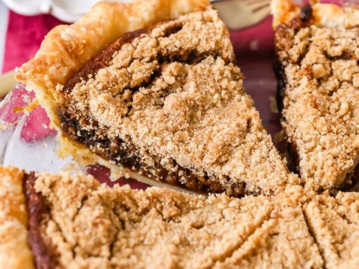 Shoofly pie that's been cut into slices in a pie plate.