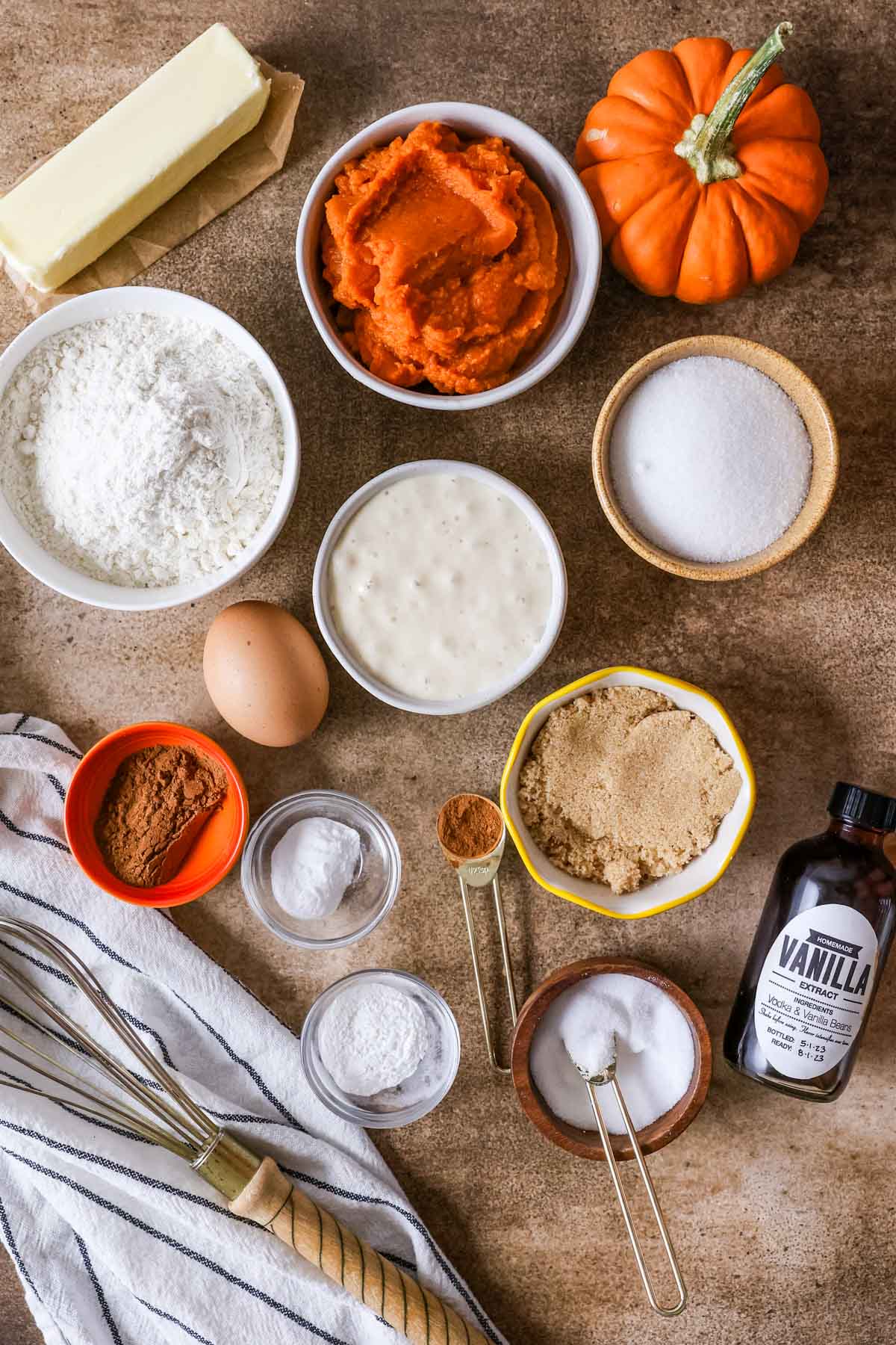 Overhead view of ingredients including pumpkin puree, sourdough discard, brown sugar, and more.