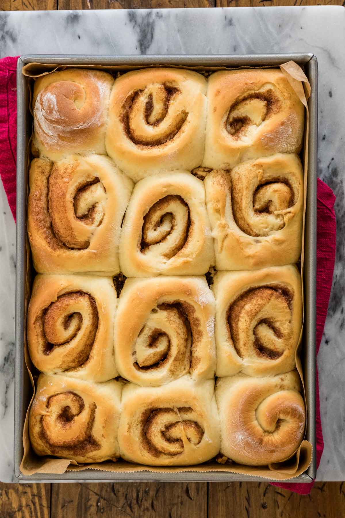 Overhead of baked sticky buns, before being flipped.